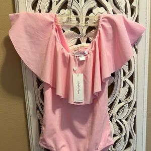 Pink ruffle swim suit by Stella Cove